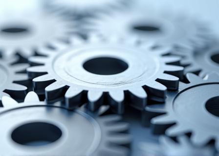 Ingranaggi che si incastrano, a simboleggiare l'implementazione efficace.